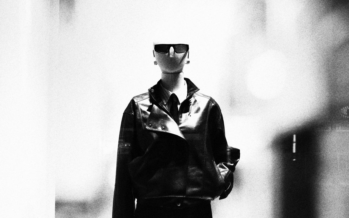 Sleek leather jacket styled with sunglasses