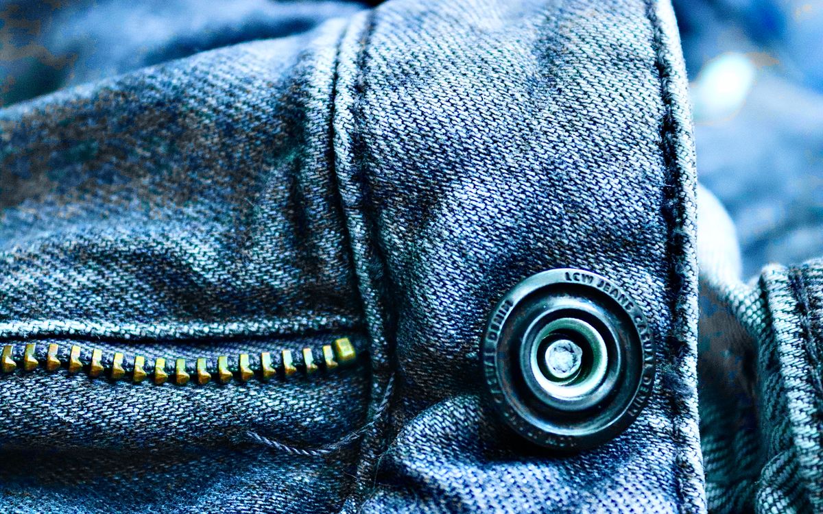 Close-up of a jacket zip and stitching showing the construction detail