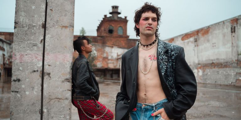 Young people in edgy punk street style wearing black leather biker jackets