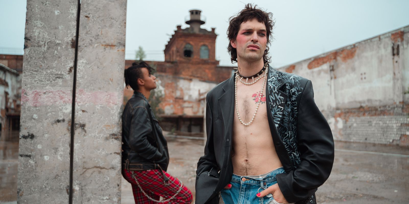 Young people in edgy punk street style wearing black leather biker jackets